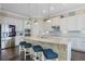 Gourmet kitchen featuring a center island with seating and stainless steel appliances at 4959 Tennessee Lake Dr, Auburndale, FL 33823