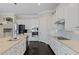 Gourmet kitchen featuring white cabinets, stainless appliances, and granite countertops at 4959 Tennessee Lake Dr, Auburndale, FL 33823