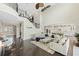 Bright, airy living room features high ceilings, dark wood floors, and an open floor plan at 4959 Tennessee Lake Dr, Auburndale, FL 33823
