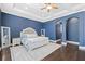 Spacious main bedroom features tray ceilings, dark hardwood floors, and a comfortable, inviting atmosphere at 4959 Tennessee Lake Dr, Auburndale, FL 33823