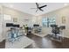 Office with multiple computer desks, ceiling fan, and large windows offering ample lighting at 4959 Tennessee Lake Dr, Auburndale, FL 33823
