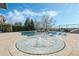 Relaxing pool and hot tub area with water feature and lounge chairs under a sunny sky at 4959 Tennessee Lake Dr, Auburndale, FL 33823