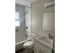 Bright bathroom featuring subway tile shower, modern sink with new cabinets and countertop at 521 Tennessee Ave, St Cloud, FL 34769