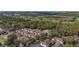 An aerial view of the homes showcases a well-maintained community surrounded by lush greenery and serene views at 5360 Diplomat Ct # 107, Kissimmee, FL 34746