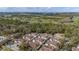 Aerial view of the community showcasing lush green landscaping, golf course views, and multiple townhomes at 5360 Diplomat Ct # 107, Kissimmee, FL 34746