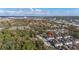 An aerial view of this community showcases a well-maintained neighborhood surrounded by lush greenery and a scenic skyline at 5360 Diplomat Ct # 107, Kissimmee, FL 34746