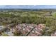 Aerial view of the community showcasing lush green landscaping, golf course views, and multiple townhomes at 5360 Diplomat Ct # 107, Kissimmee, FL 34746
