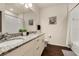Well-lit bathroom featuring double sinks, granite countertops, and modern fixtures at 5360 Diplomat Ct # 107, Kissimmee, FL 34746