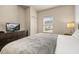 Bedroom featuring a queen sized bed, dresser, and natural light from window at 5360 Diplomat Ct # 107, Kissimmee, FL 34746