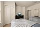 Carpeted bedroom with twin beds, a dresser, and a double door closet at 5360 Diplomat Ct # 107, Kissimmee, FL 34746