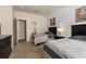 Carpeted bedroom featuring twin beds, a dresser, and natural light at 5360 Diplomat Ct # 107, Kissimmee, FL 34746