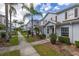 Row of townhouses with sidewalks, landscaped lawns, and plenty of curb appeal at 5360 Diplomat Ct # 107, Kissimmee, FL 34746