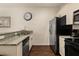 Well-organized kitchen features granite counters, sleek appliances, and ample counter space at 5360 Diplomat Ct # 107, Kissimmee, FL 34746