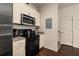 Efficient kitchen features modern appliances, light cabinets, and convenient access to the stairs at 5360 Diplomat Ct # 107, Kissimmee, FL 34746