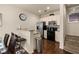 Efficient kitchen includes stainless steel appliances, a breakfast bar and wood floors at 5360 Diplomat Ct # 107, Kissimmee, FL 34746