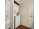 Efficient laundry area with stacked washer and dryer unit inside the bathroom at 5360 Diplomat Ct # 107, Kissimmee, FL 34746