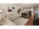 Open floor plan with a seamless transition from living room to kitchen at 5360 Diplomat Ct # 107, Kissimmee, FL 34746