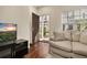 Cozy living room with a view of the entryway, the front door and a window at 5360 Diplomat Ct # 107, Kissimmee, FL 34746