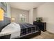 Inviting bedroom features neutral decor, a queen bed, and plenty of natural light at 5360 Diplomat Ct # 107, Kissimmee, FL 34746