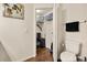 Toilet room featuring a toilet, linen closet, and hardwood floors at 5360 Diplomat Ct # 107, Kissimmee, FL 34746
