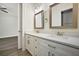 Dual sink bathroom vanity with decorative mirrors and pendant lighting at 5701 Crestview Dr, Lady Lake, FL 32159
