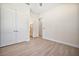 Bright bedroom featuring a spacious closet and ensuite bathroom, with wood-look tile flooring at 5701 Crestview Dr, Lady Lake, FL 32159