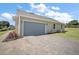 Spacious two-car garage with a paved driveway and manicured landscaping at 5701 Crestview Dr, Lady Lake, FL 32159