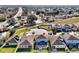 An aerial view of newly constructed homes showcases modern design and community planning at 580 Seattle Slew Dr, Davenport, FL 33837