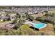 Aerial view of a Primary planned community featuring pool, playground, and manicured lawns at 580 Seattle Slew Dr, Davenport, FL 33837