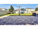 Spacious backyard featuring a basketball hoop, paver patio, green lawn, and playground at 580 Seattle Slew Dr, Davenport, FL 33837