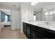 Bathroom features a double sink vanity, tile flooring, and a shower at 580 Seattle Slew Dr, Davenport, FL 33837