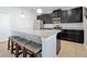 Elegant kitchen featuring a center island with bar stool seating and pendant lighting at 580 Seattle Slew Dr, Davenport, FL 33837