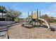 Playground with a slide and climbing structure set on a mulch surface provides a safe play area at 580 Seattle Slew Dr, Davenport, FL 33837