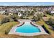 Community pool with landscaped area surrounded by neighborhood homes at 580 Seattle Slew Dr, Davenport, FL 33837