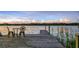 Relaxing lake view with dock featuring chairs and table, creating a serene outdoor space at 6845 Old Melbourne Hwy, St Cloud, FL 34771