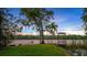 Lakeside view with charming dock and tree swing, ideal for relaxation and waterfront enjoyment at 6845 Old Melbourne Hwy, St Cloud, FL 34771