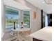 Eat-in kitchen area with table, chairs, and a view of the backyard swimming pool at 6845 Old Melbourne Hwy, St Cloud, FL 34771