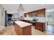 Gourmet kitchen with stainless steel appliances, granite countertops, and a center island at 6845 Old Melbourne Hwy, St Cloud, FL 34771