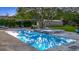 Backyard oasis featuring a large pool, spa, surrounding trees, and lush landscaping at 6845 Old Melbourne Hwy, St Cloud, FL 34771