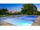 An inviting backyard pool and spa surrounded by lush greenery, creating a serene retreat at 6845 Old Melbourne Hwy, St Cloud, FL 34771