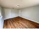 Bedroom featuring wood flooring, closet and door at 708 Se Pine Ave, Fort Meade, FL 33841