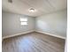 Bedroom featuring modern vinyl flooring and a window view at 708 Se Pine Ave, Fort Meade, FL 33841