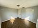Bedroom featuring wood flooring, closet and door at 708 Se Pine Ave, Fort Meade, FL 33841