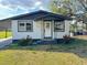 Charming single-story home featuring a covered entrance and well-maintained front yard at 708 Se Pine Ave, Fort Meade, FL 33841