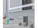 Contemporary bathroom featuring a waterfall faucet and LED mirror at 7671 Comrow St # 303, Kissimmee, FL 34747