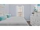 Comfortable bedroom with large bed, white bedding, and bright natural light at 7671 Comrow St # 303, Kissimmee, FL 34747