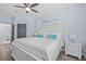 Bright bedroom with a king-size bed, stylish decor, and ample natural light at 7671 Comrow St # 303, Kissimmee, FL 34747