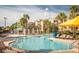The community pool and sundeck are surrounded by palm trees and offer a relaxing retreat for residents at 7671 Comrow St # 303, Kissimmee, FL 34747
