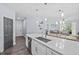 Spacious island kitchen offering sleek countertops, stainless steel appliances, and ample natural light at 7671 Comrow St # 303, Kissimmee, FL 34747