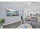 Open-concept layout showcasing a living room with adjacent dining area and modern kitchen at 7671 Comrow St # 303, Kissimmee, FL 34747